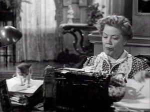 You Can’t Take it With You: Spring Byington as Penny Sycamore, a woman who became a writer because a typewriter was delivered to her house by mistake (and who wrote amid a commotion of kittens; note the furry paperweight)